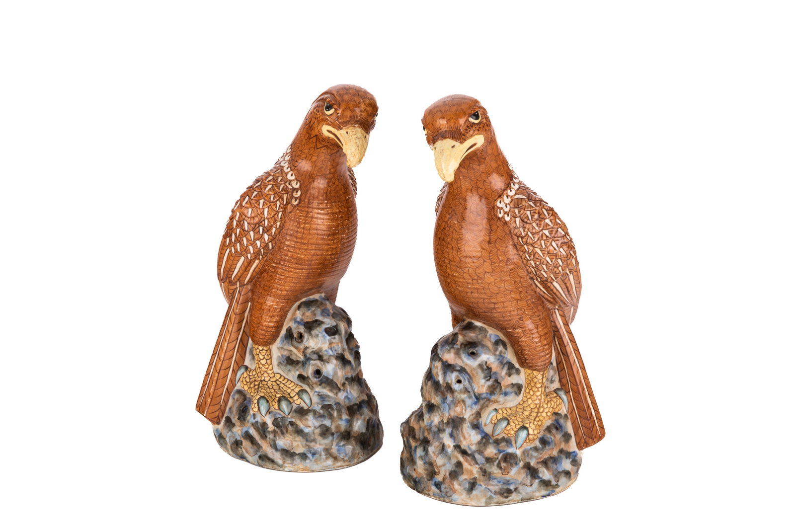 PAIR OF CHINESE EXPORT STONEWARE GOLDEN EAGLES: Polychrome glazed eagle birds on rocky bases, four character Chinese marks to base, 20th C in the manner of Kangxi.H. 18.5in x W. 7.5in x D. 8.7in (47cm x 19cm x 22cm)