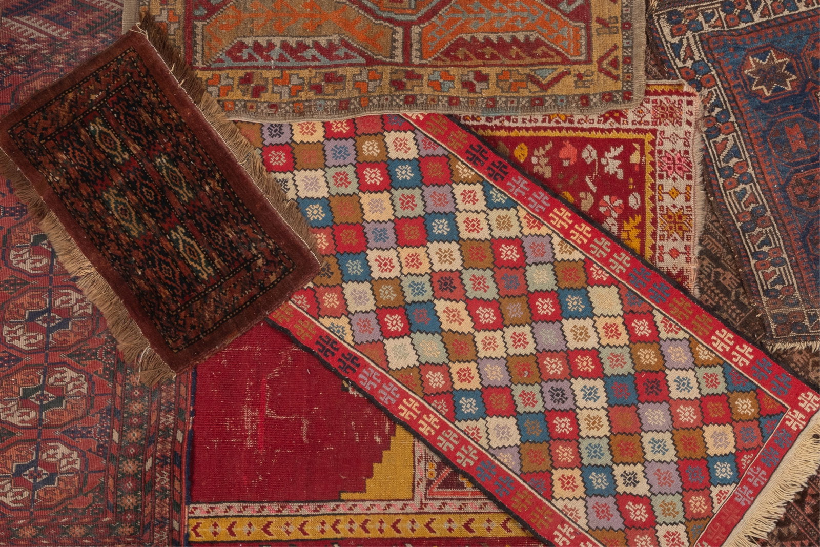 A COLLECTION OF ANTIQUE PERSIAN RUGS (1 of 2)