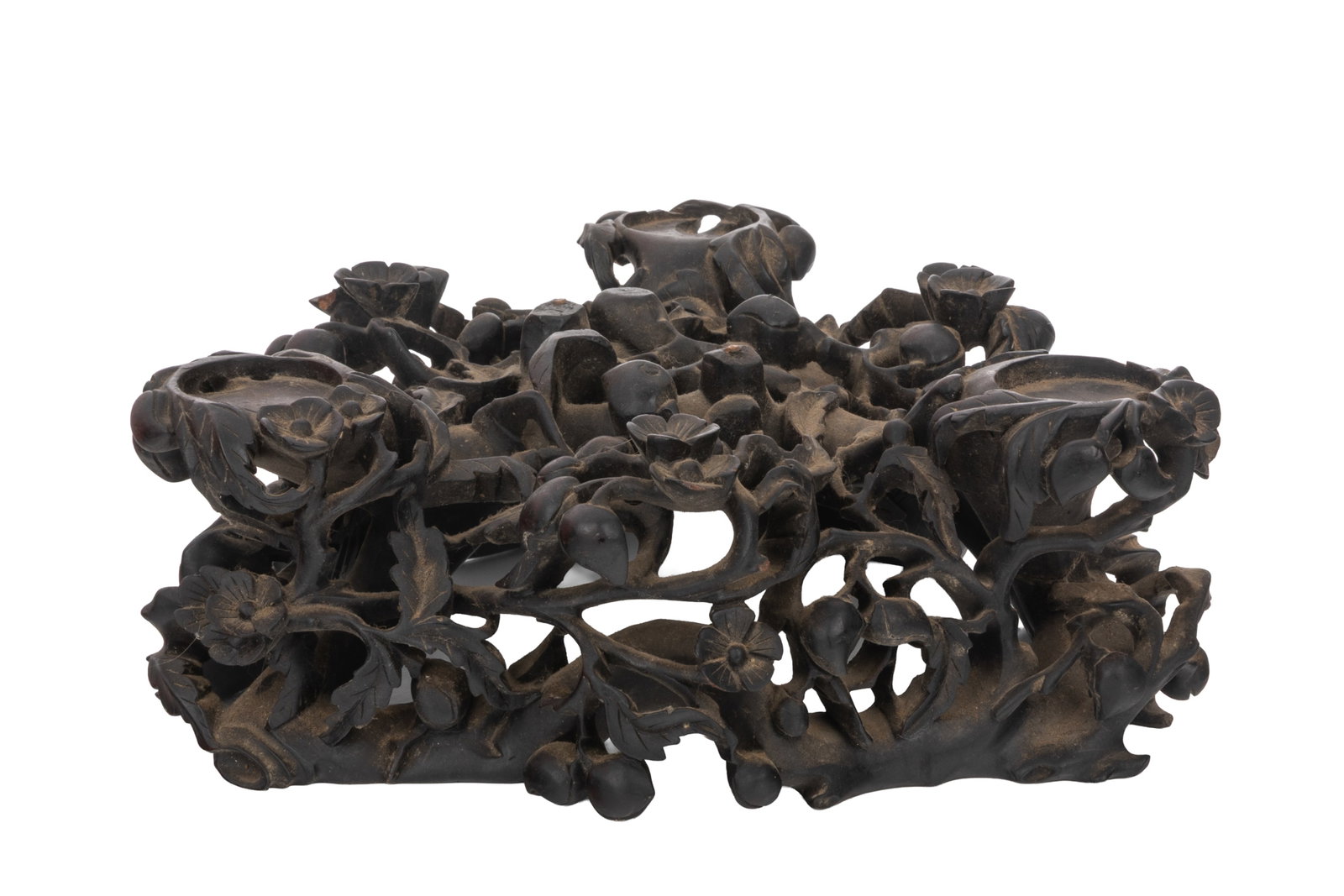 CHINESE CARVED HARDWOOD TRIPOD STAND: Antique triangular wood stand with scrolling flowers, foliage and peaches, supports for a tripod censer, Qing dynasty.