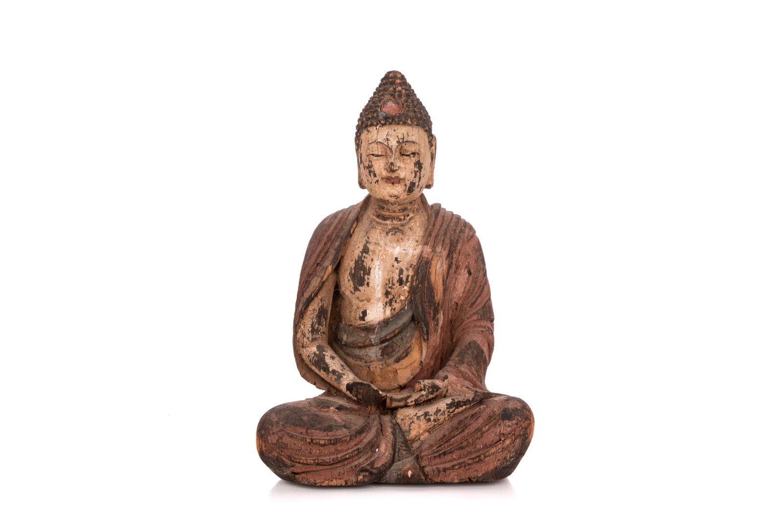 YUAN TO MING CARVED WOOD SEATED BUDDHA: Depicting Buddha in robes seated in dhyanasana and hand in bhairavamudra. Export seal and hollow spirit box to the back. Yuan to Ming dynasty, 14th to 15th century. H. 46.5 cm