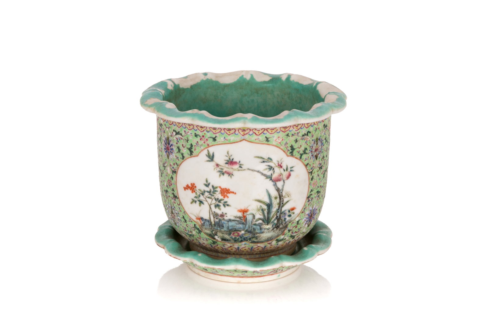FAMILLE ROSE LIME GREEN GROUND PLANTER AND STAND: The body decorated with two mallow form panels depicting bird and florwer motif and peaches, setting against a lime green ground with bats and scrolling florals. Two drainage holes to the base. Interi