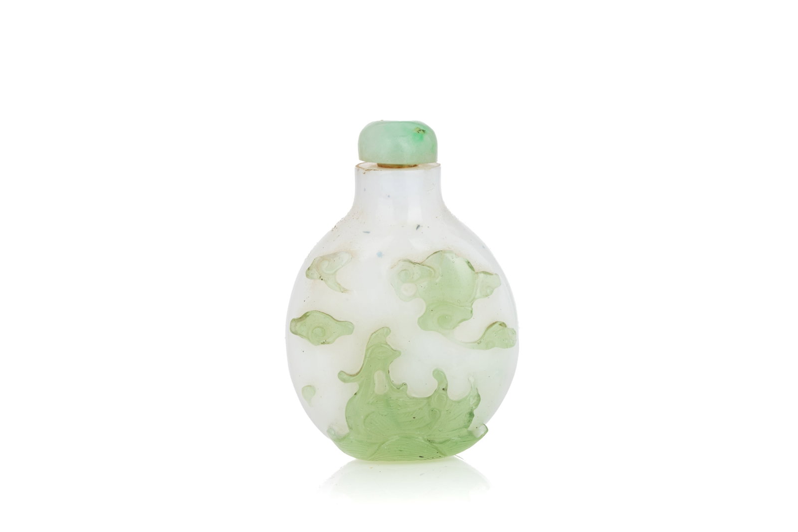 LIME GREEN OVERLAY WHITE GLASS SNUFF BOTTLE: Of flattened ovoid form. Carved in lime green overlay to the white ground with Mandarin ducks and clouds on both sides. Jadeite stopper. Qing dynasty, 18th century. H. 6.5 cm Snuff Bottle Collection o