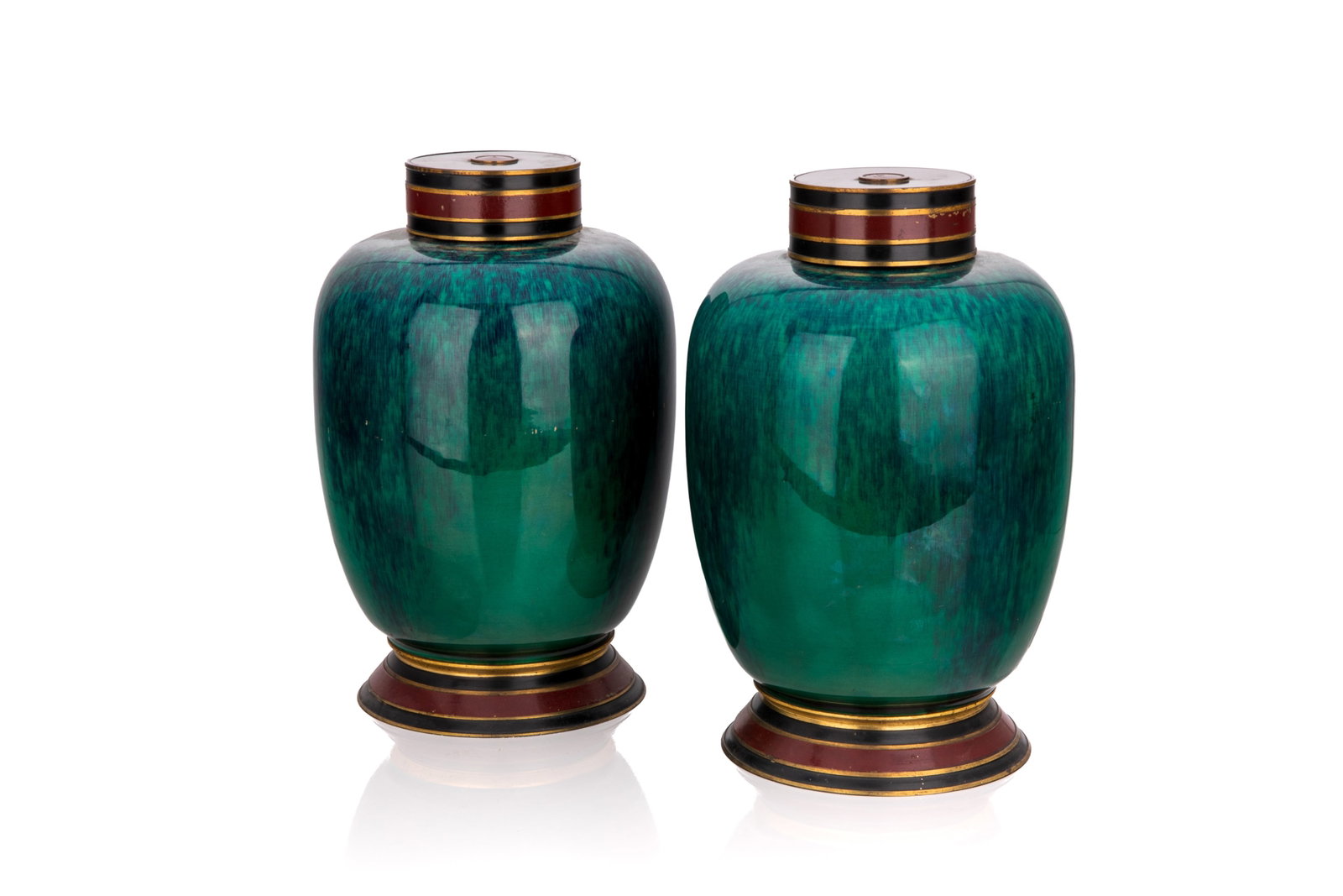 PAIR OF ART DECO SEVRES PORCELAIN URNS: A pair of French Art Deco modernist period lidded vases, circa 1920 to 1930. Green to blue flamed enamel glaze with metal mounts, Sevres marks hidden. H. 23.5 cm (9 1/4in)