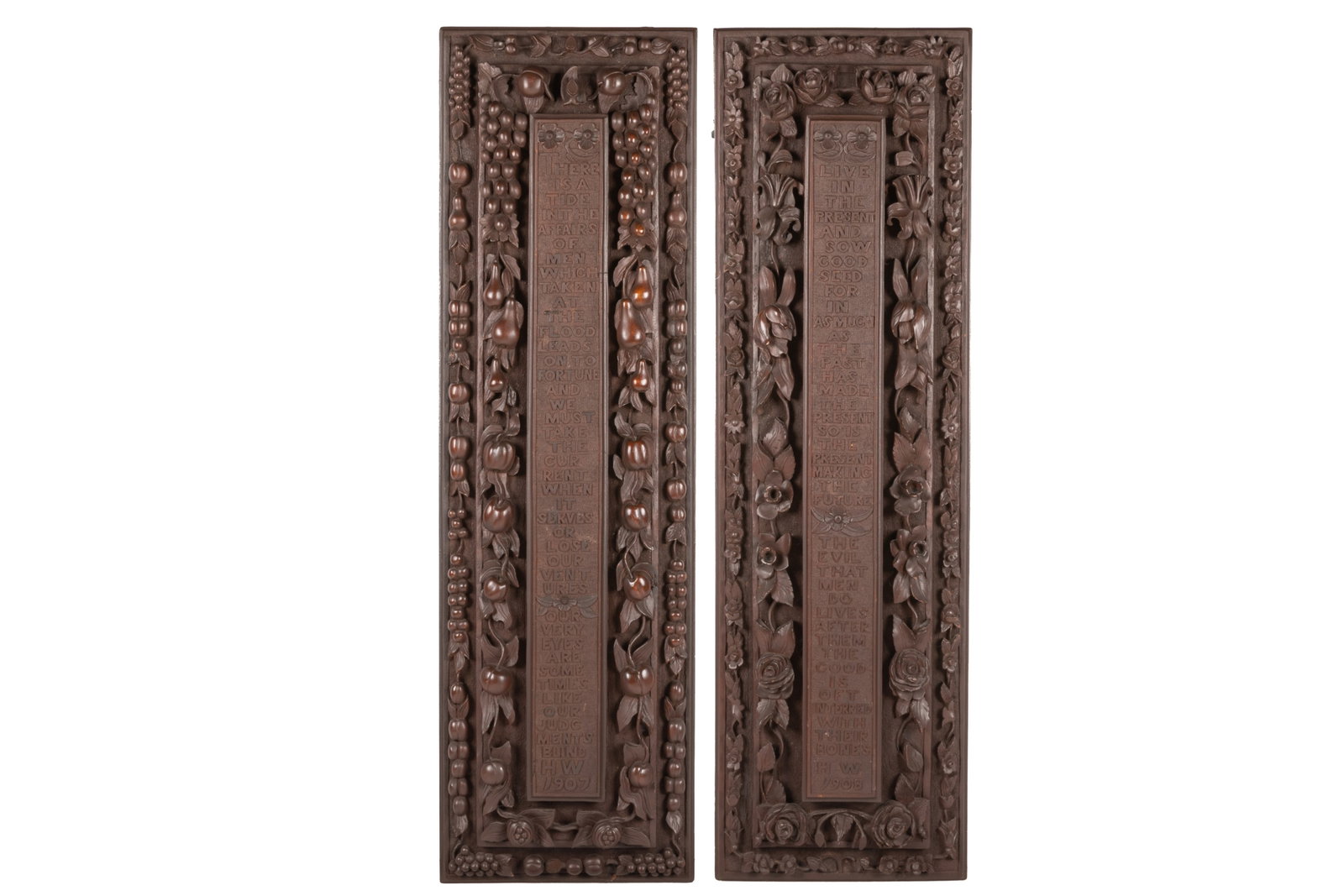 PAIR OF ARTS & CRAFTS CARVED WOOD POETIC PANELS: Each carved with a verse. Left from William Shakespeare: Brutus of Julius Caesar. Right from the New Testament Matthew 13:23. Both initialed H.W. 1907 / 08. H 49 1/2in x L 14 1/2in