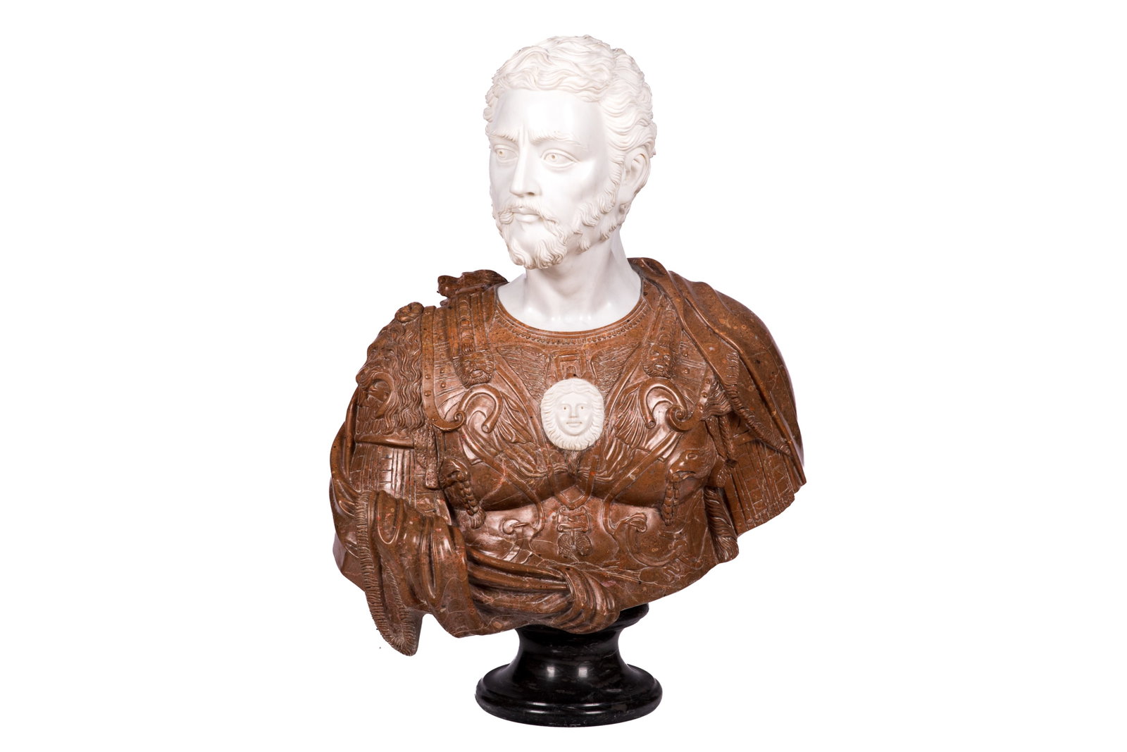 CARVED MIXED MARBLE BUST OF A MEDICI: The finely carved white marble head turned slightly to the right, wearing elaborate red marble armor depicting Cosimo de Medici. Raised on a matching marble column. Italian, 20th C. Bust H. 33 1/2in