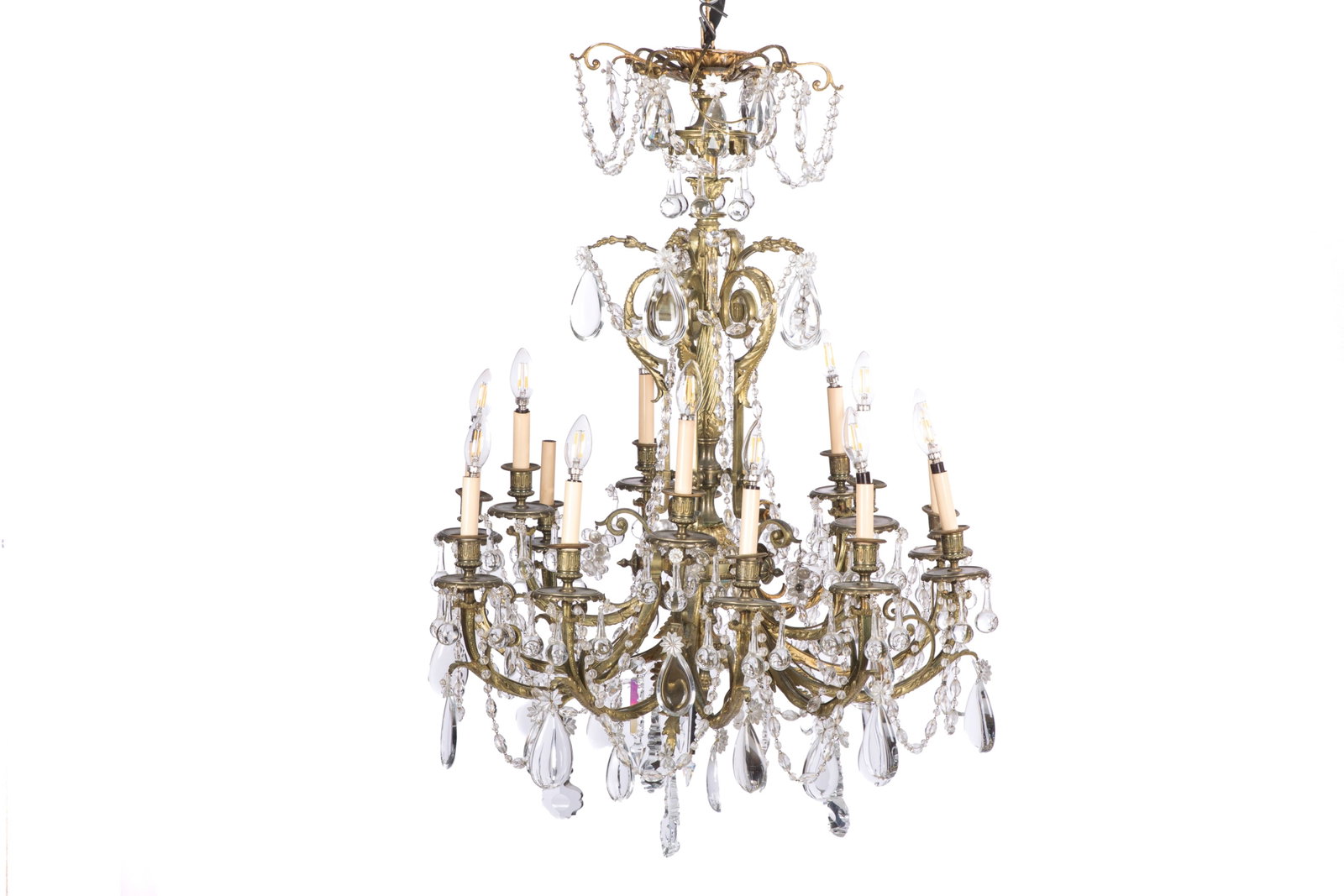 ANTIQUE CUT GLASS AND BRONZE CHANDELIER: Multi light bronze fixture with heavy crystal drops and chains. H 40in x Dia 28in
