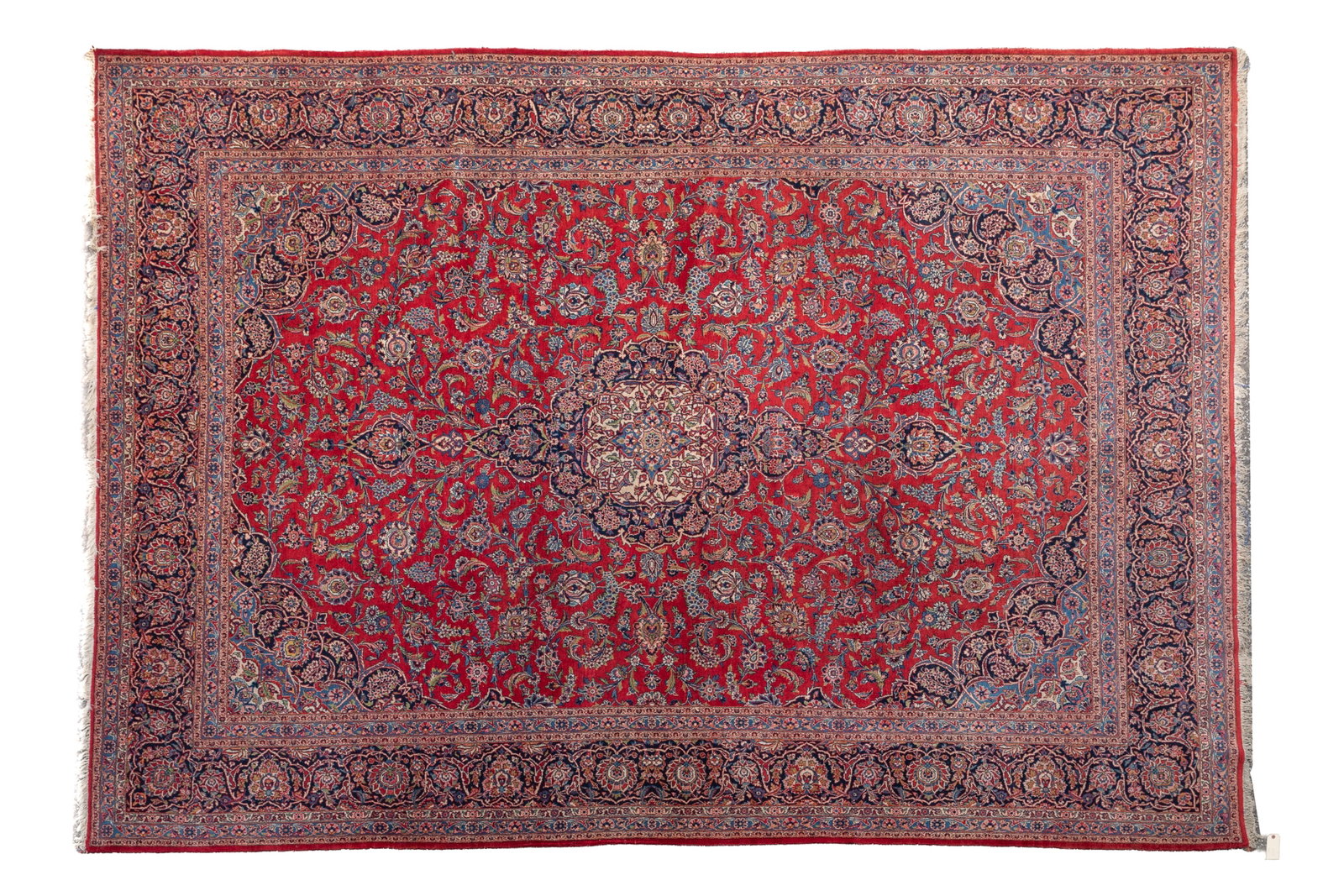 VINTAGE PERSIAN KASHAN WOOL CARPET: Kashan carpet with Floral medallion design, red field and navy border 13ft 10in x 9ft 9in