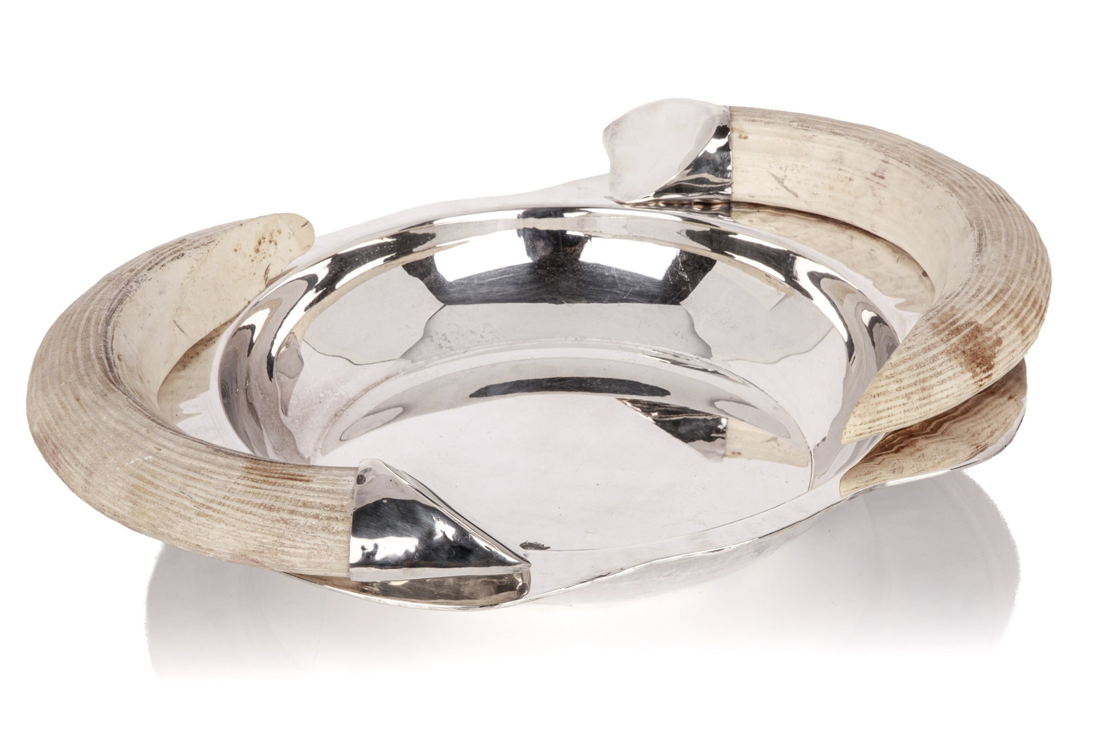 FRANCO LAPINI VINTAGE ITALIAN SILVERPLATE TRAY: Hammered rim, fitted on either side with faux tusk handles mounted in polished silver-plated caps; stamped Franco Lapini to the underside. H. 4 1/2in x W. 20 3/4in x D. 14 1/2in (11.4cm x 52.7cm x 36.