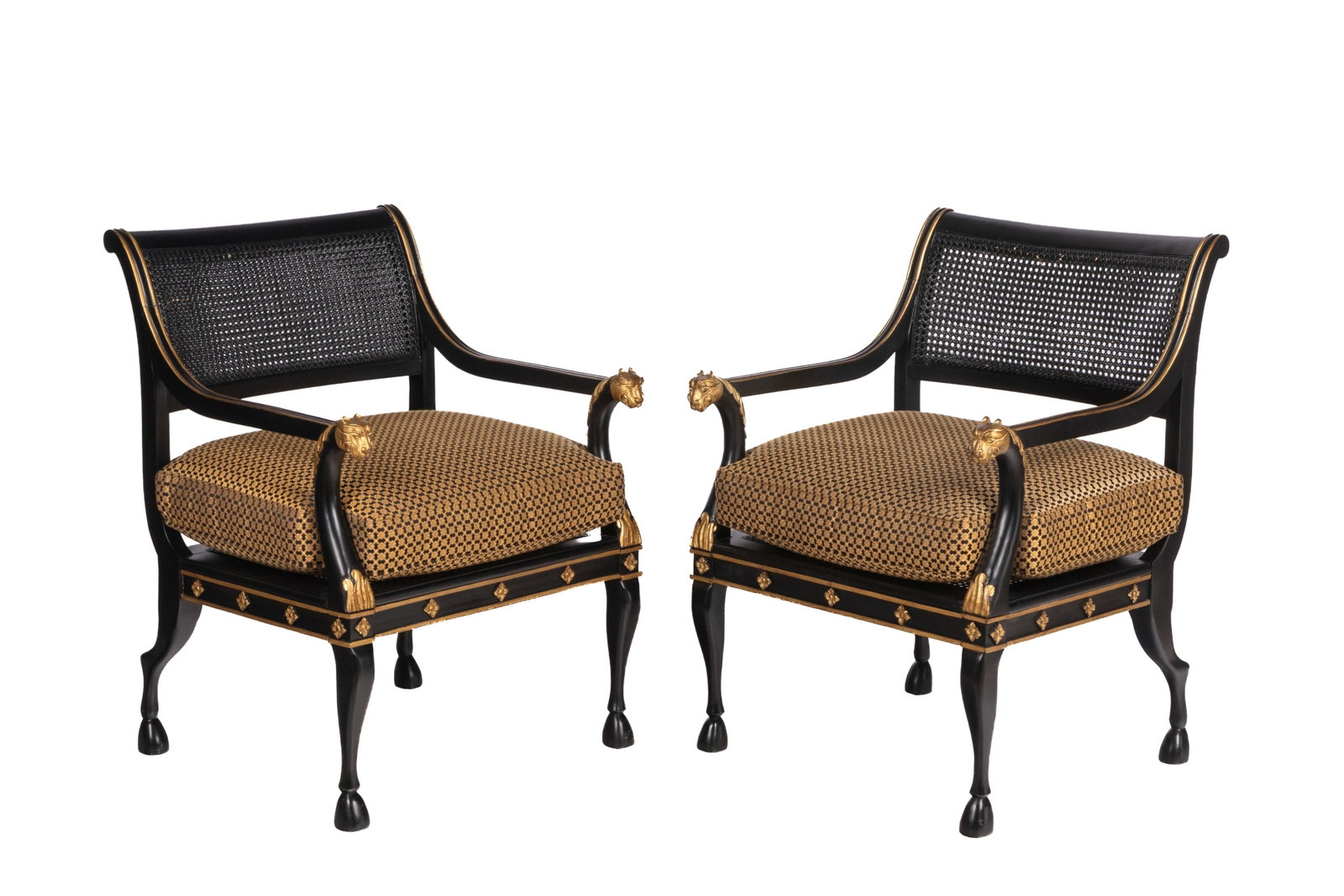 PAIR OF OVERWIZED CANED ARMCHAIRS: Black painted with gilded highlights, animal head handles and oversized upholstered seats, 20th C. H 36 1/2in x W 26in x D 23in