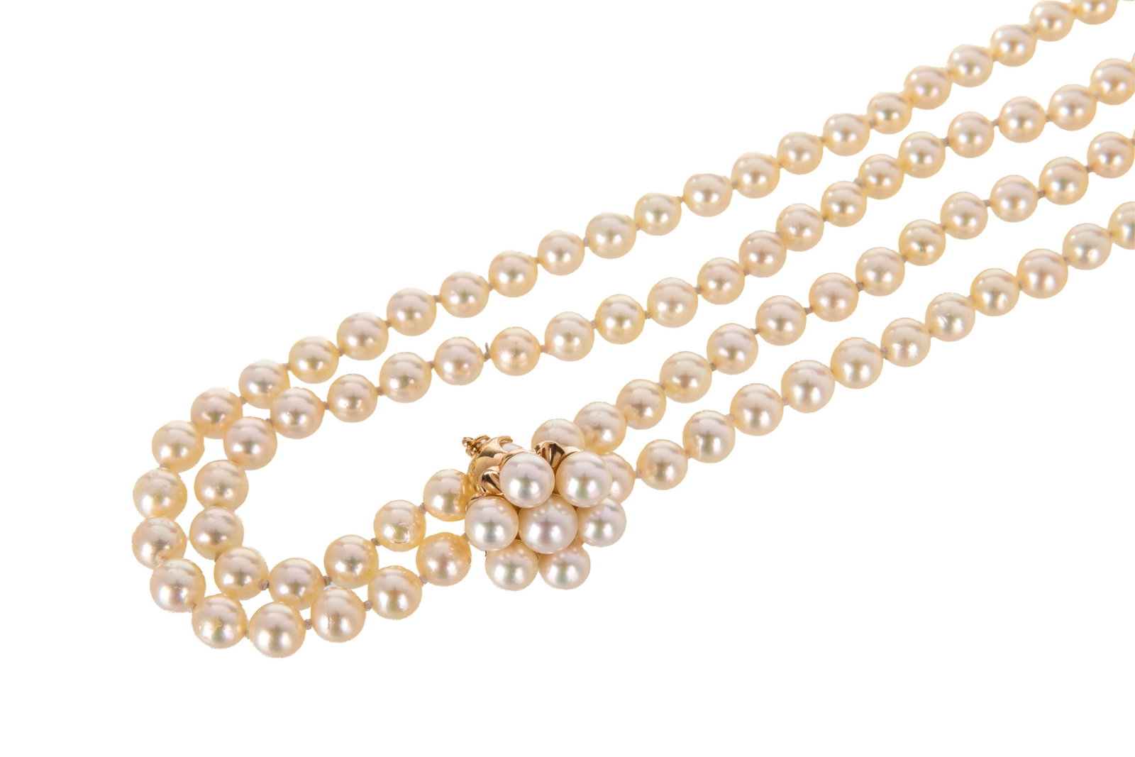 34 INCH PEARL NECKLACE, ADJUSTABLE-WEAR 14K CLASP: 34 inch long knotted freshwater pearl necklace measuring between 6.4mm - 6.9mm, continuous, cream body colour with good to very good luster, lightly to moderately spotted. Featuring 14K yellow gold en