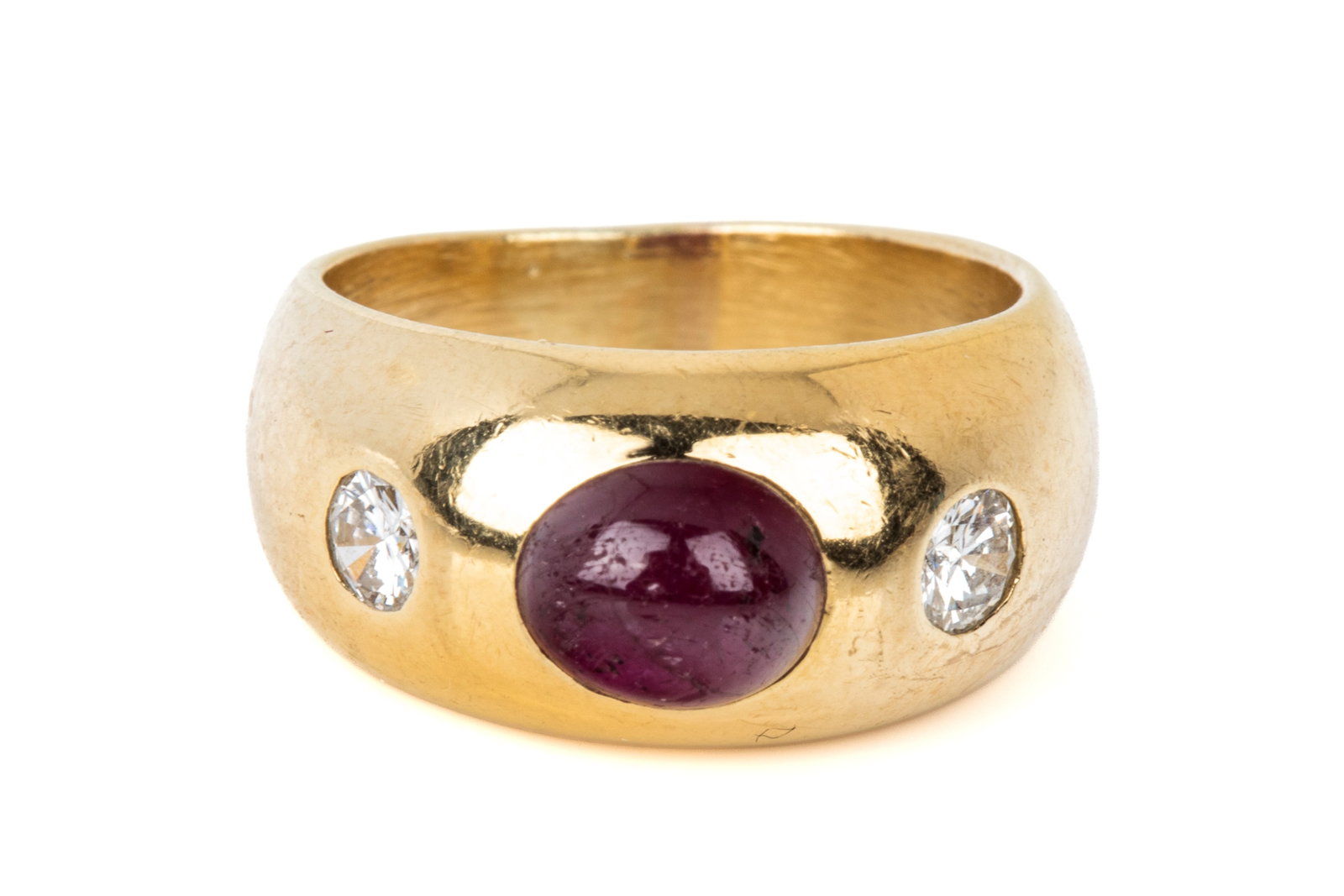 18K RUBY & DIAMOND DOME RING 8.5g: 18K yellow gold dome ring measuring 8.8mm wide by 5.3mm tall. Featuring 1 cabochon cut natural ruby, heavily included. Accented by 2 round brilliant cut diamonds of VS-IJ quality. Size 3.5 8.5 grams