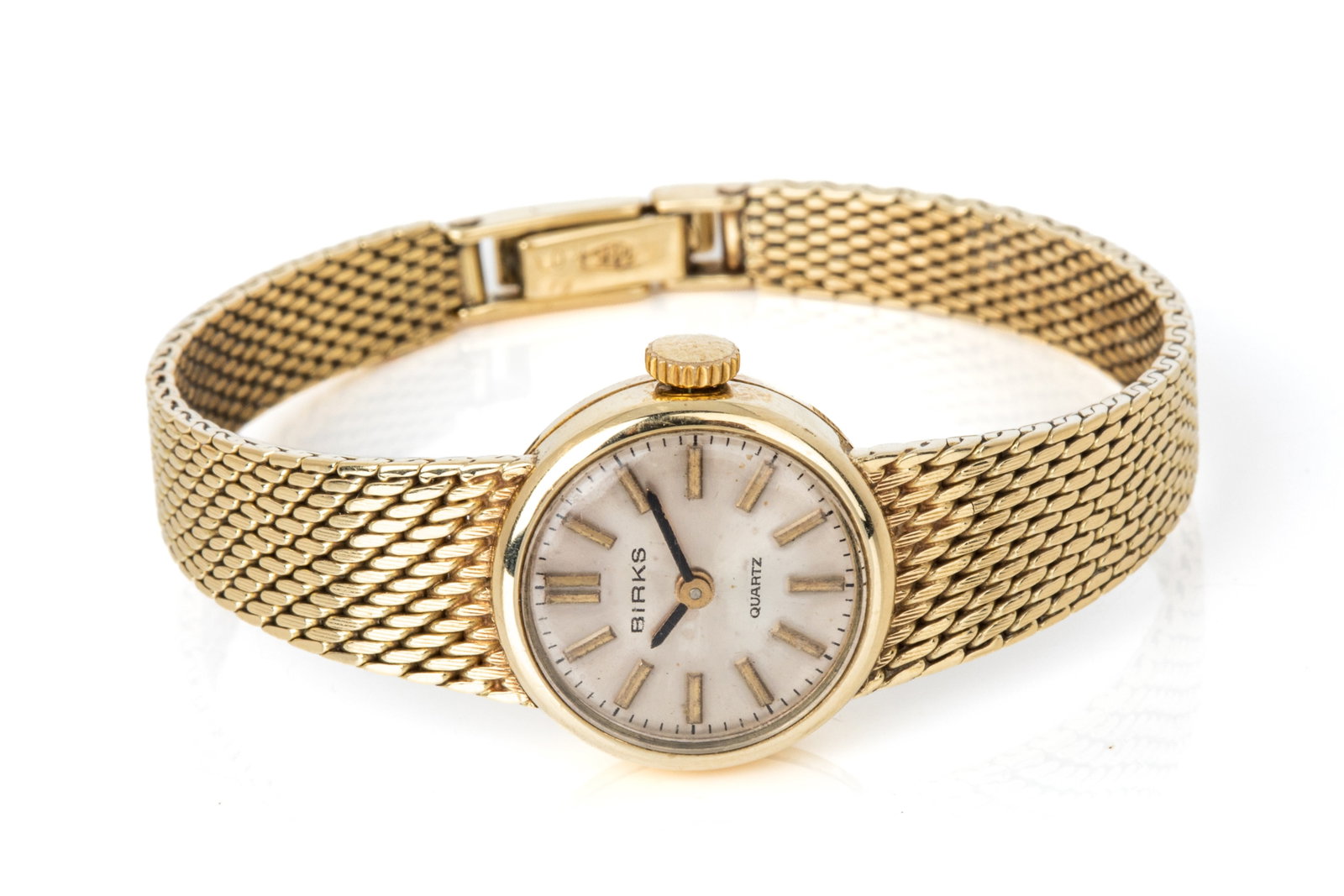 14K YELLOW GOLD LADIES BIRKS WATCH QUARTZ 24.8g: 14K yellow gold Birks quartz watch, round case measuring 18.9mm wide, 6 inch wearable length, plastic dome crystal, silver-tone dial. Observed to set and run with new cell. 21.4 grams without movement