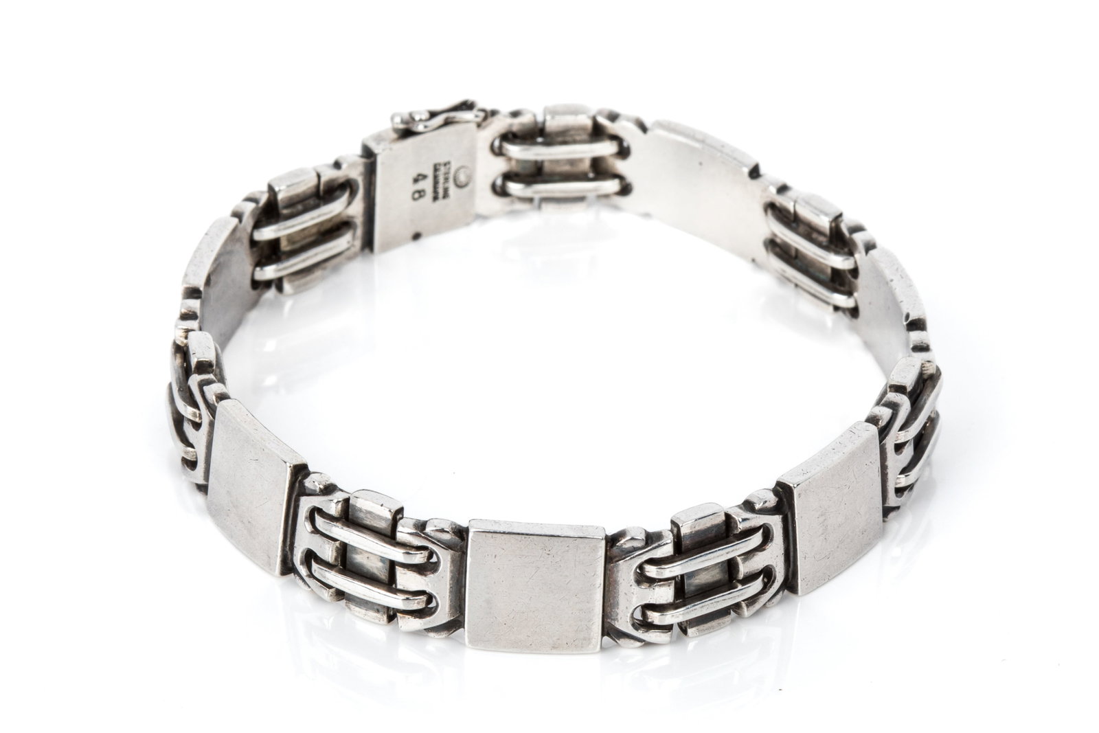 GEORG JENSEN & OSCAR GUNDLACH-PEDERSON BRACELET: Vintage Georg Jensen sterling silver bracelet model 48, design attributed to Oscar Gundlach-Pedersen. Measuring 7.25 inches wearable length by 10.4mm wide, equipped with box catch and side safety. Pos