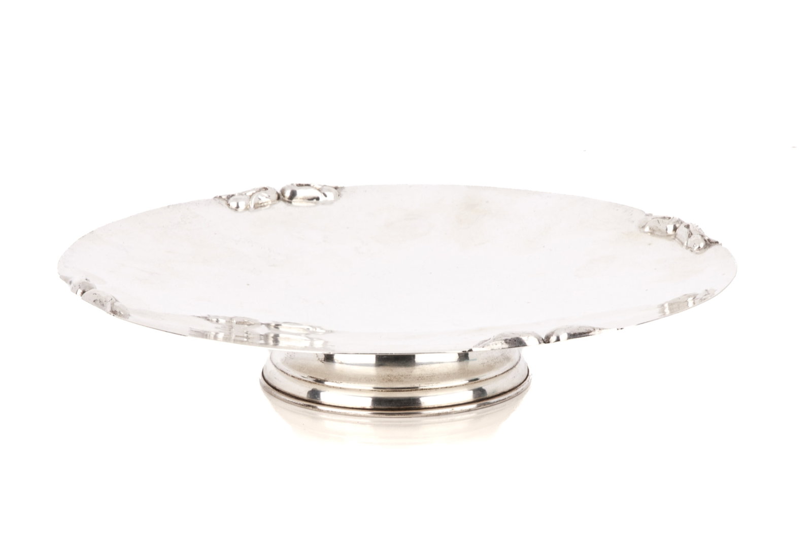PETERSEN SILVER COMPORT, 415g: A Canadian sterling silver low comport by Poul Petersen of Montreal. The shallow bowl is decorated with four pairs of flower buds. weight 415 g Diameter 10.2 in 26 cm
