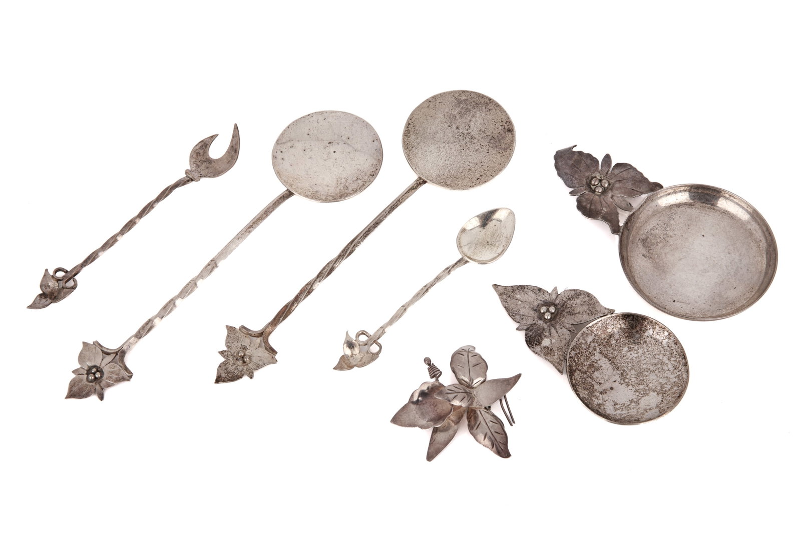SEVEN SILVER ITEMS BY DOUGLAS BOYD, 145g: A group of sterling silver items by Richmond Hill silversmith Douglas Boyd. All the items have a Trillium in their design and include three spoons, a caddy spoon an ashtray a condiment fork and brooch