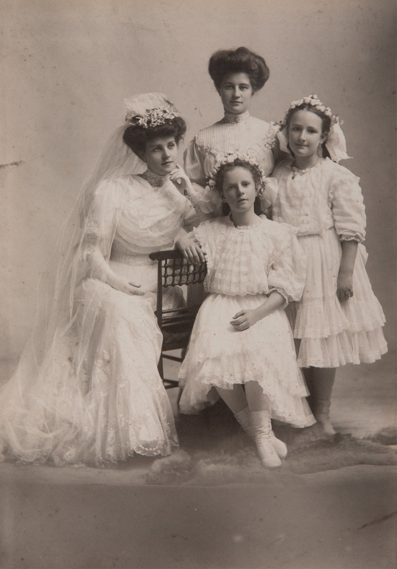 RARE ORIGINAL PHOTOGRAPH OF THE ROMANOVA DAUGHTERS: A rare photograph of Grand Duchess Olga (seated), Grand Duchess Tatiana, Grand Duchess Maria, and Grand Duchess Anastasia. Likely captured in the early 1890s, considering Grand Duchess Anastasia's