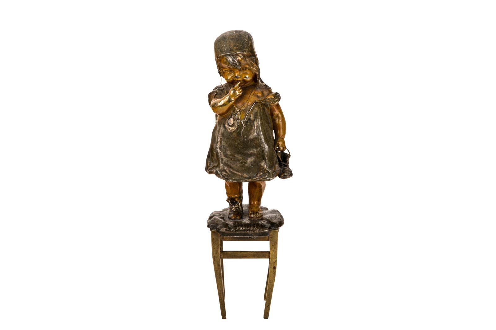 AFTER JUAN CLARA AYATS: Bronze sculpture of a young girl standing atop a stool, traditionally attributed to Spanish sculptor Juan Clara. The piece features a multi-toned finish with a darker brown-green patina on the dress
