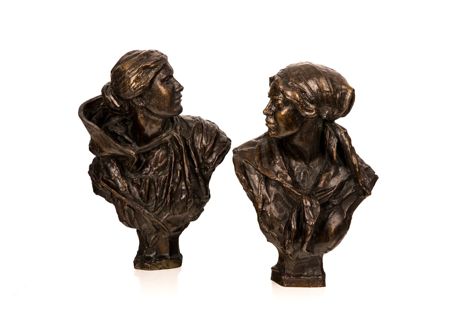 JAMES PITTENDRIGH MACGILLIVRAY(Scottish,1856-1938): A pair of patinated bronze portrait busts of women, each signed and dated; one 1916 wearing a hooded cloak, the other 1919 wearing a tied headscarf. H. 14 1/8in (36cm)