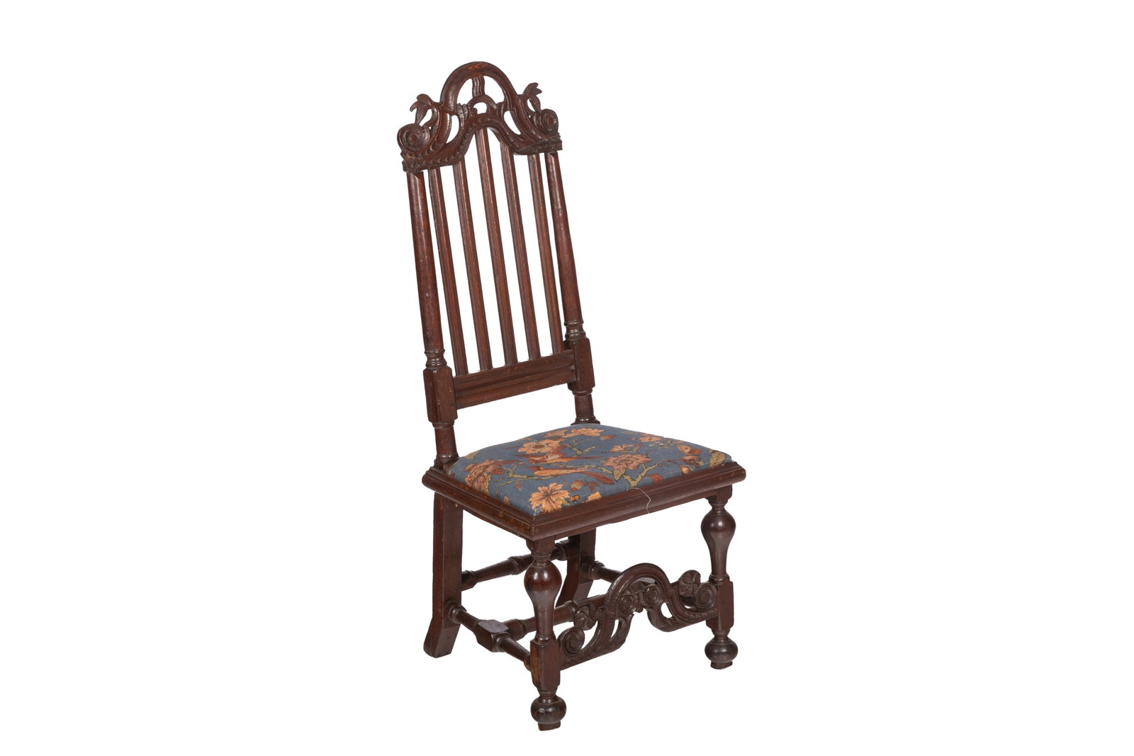 CARVED CHARLES II OAK CHAIR: 17th century. A Charles II carved oak high-back chair, having an arched crest rail above a five-slat back, the upholstered seat raised on turned front legs joined by a carved arched stretcher. H. 46in
