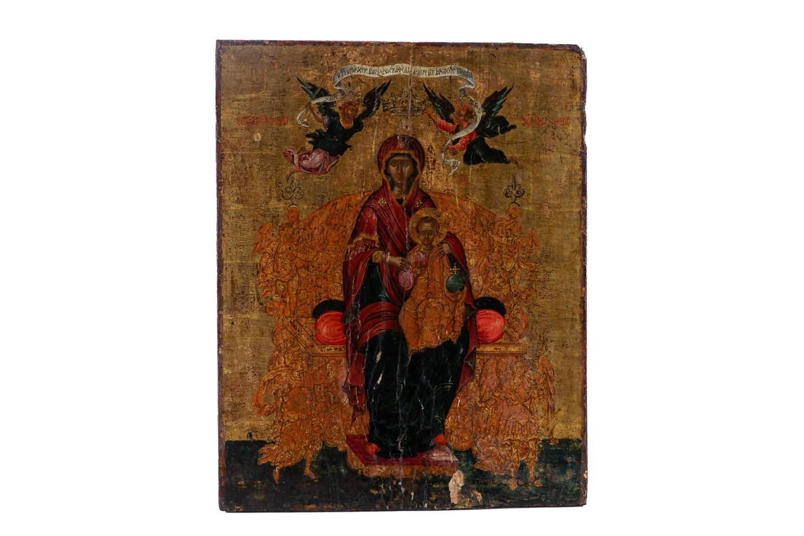 CRETAN ICON (16th C): Religious icon painted on wooden panel depicting the Madonna & Child seated on a throne, flanked by angel, against a gold background. Label to verso identifies that icon as Cretan in origin (16th