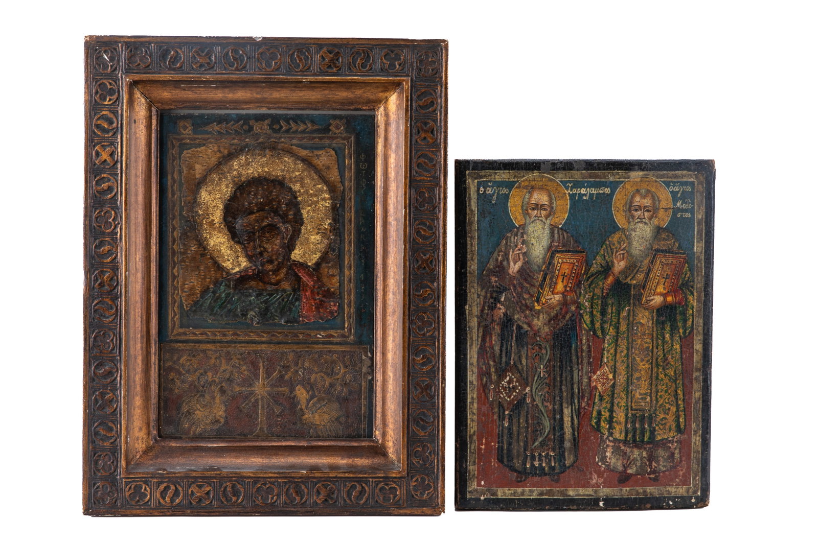 PAIR OF ANTIQUE GREEK ORTHODOX ICONS: Two antique Greek Orthodox icons painted on wood. One framed (H. 15 1/4" x W. 11 3/4") and the other unframed (H. 11 1/2" x W. 8 1/2").
