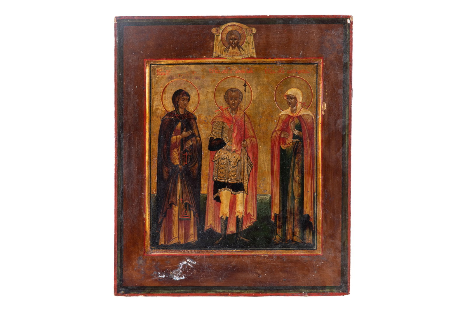 ANTIQUE EASTERN ORTHODOX ICON: Antique Eastern Orthodox icon painted on wood depicting three saints. H. 14" x W. 11 3/4"
