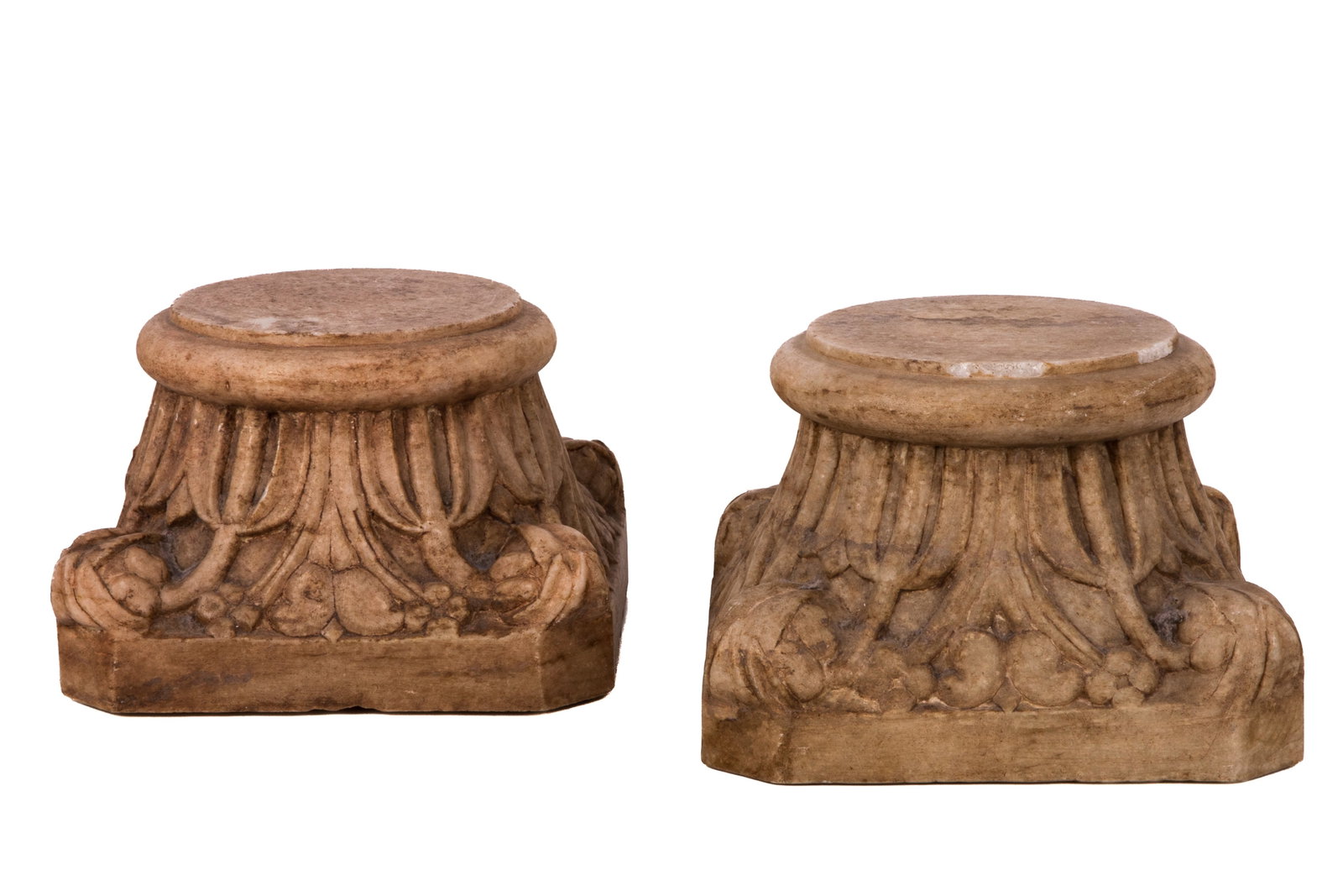 TWO ARCHITECTURAL CARVED STONE CAPITALS: Carved stone Corinthian capitals. Age unknown. H 5 /34 x W 9 1/4in