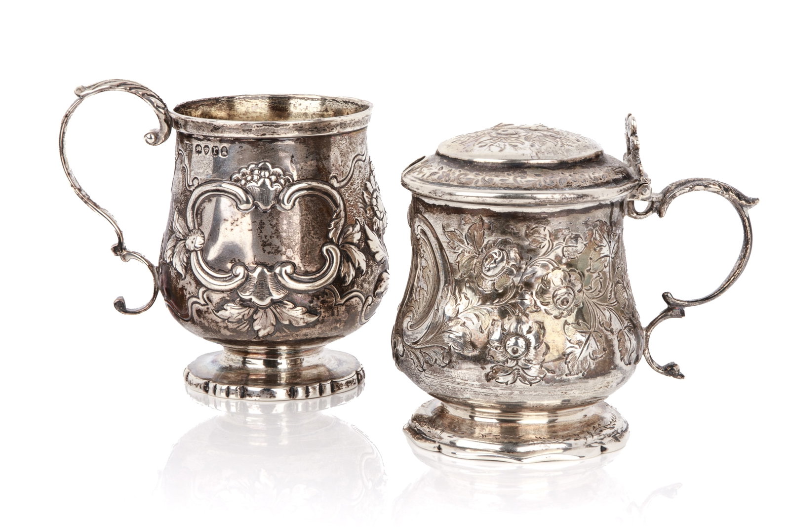 ENGLISH SILVER CANN & MUSTARD POT, 264g: Both with floral repousse decoration. Georgian mug EB and a Victorian covered mustard pot, makers D.P. Weight 264 grams Tankard H. 3 1/2in (9cm)