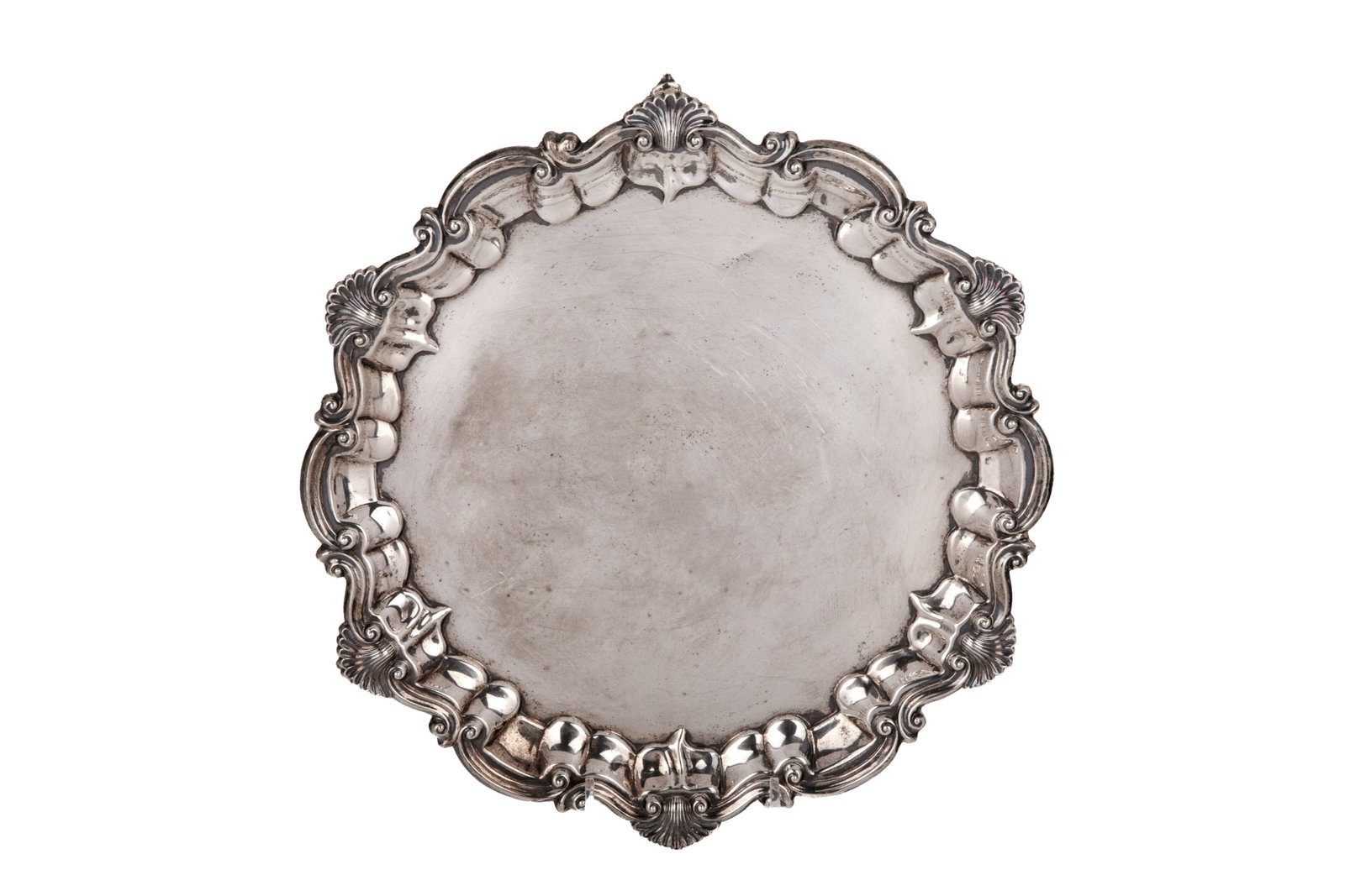 VICTORIAN FOOTED SILVER SALVER, 558g: Circular form with a shell and scroll border, raised on three feet. Hallmarked Birmingham, 1898, maker Barker Brothers. Weight 558grams Dia. 10 3/4in (27.3cm)