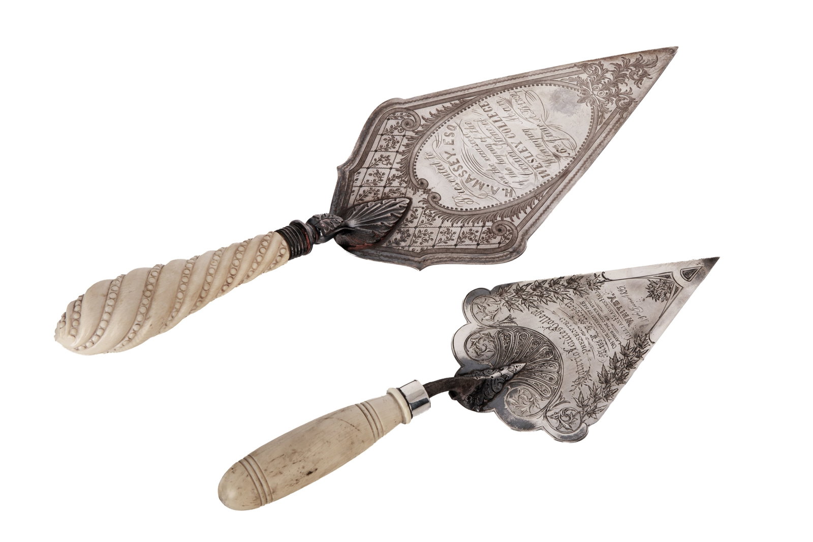TWO CANADIAN PRESENTATION TROWELS: A sterling silver and natural material trowel together with a silver plated example with a similar handle, both late 19th century. The sterling example by Ryrie of Toronto.