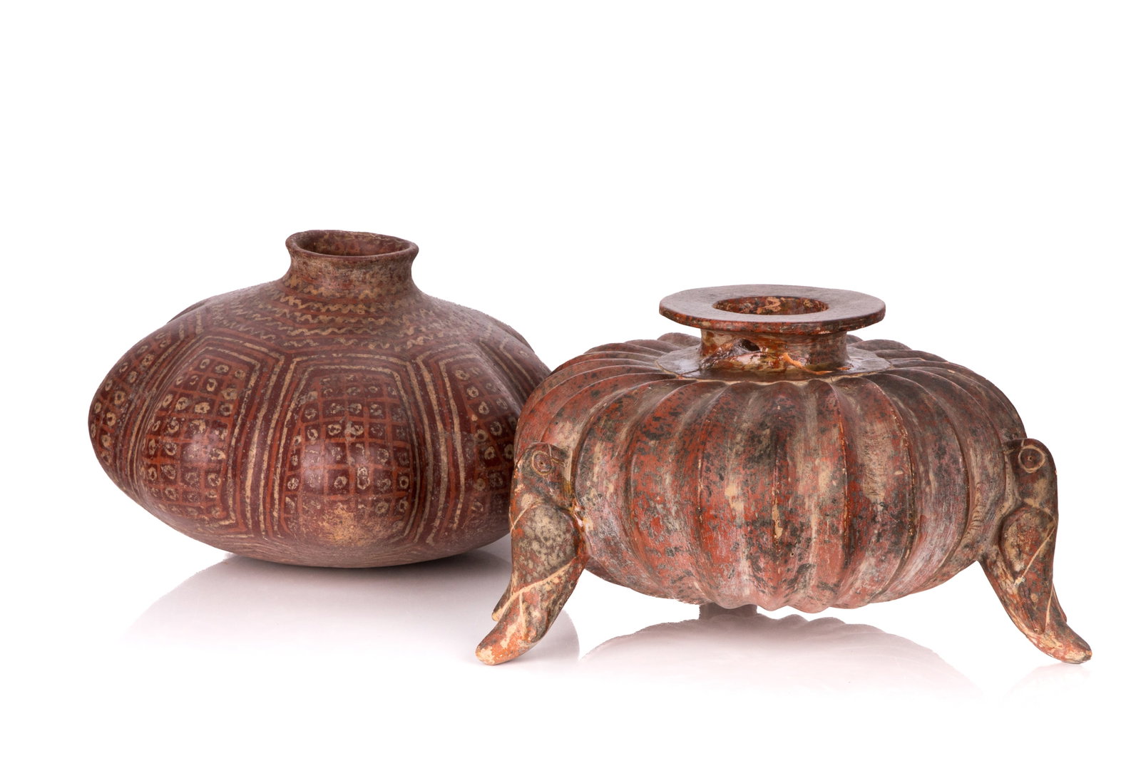 TWO PRE-COLUMBIAN GOURD VASES: Squash ribbed Colima Olla pot with three bird-figural feet, the other with geometric designs along the swells of the shape. H. 7 1/2in x Dia. 11 3/4in (8.9cm x 39.7cm) H. 7 3/4in x Dia. 12in (19.6cm x