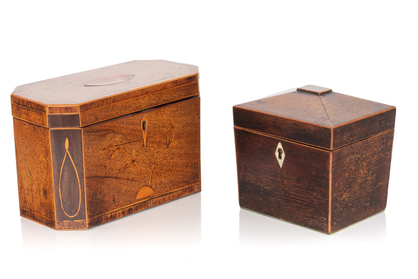 TWO GEORGE III WOOD TEA CADDIES: Comprising 1 octagonal inlaid mahogany caddy with a two-compartment interior to hold tea leaves, lockable lid with no keys; 1 rectangular caddy featuring an inner wooden cover, naturally carved escutc