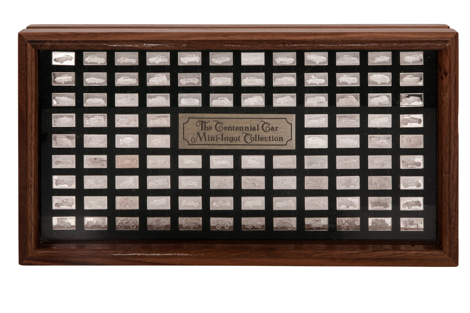 FRANKLIN MINT MINI-INGOT SILVER COLLECTION: 20th century. A boxed set consisting of 100 sterling silver mini-ingots commemorating iconic automobiles, housed in the original fitted wooden display case. Each ingot weight approx. 1.6 grams Case: 1