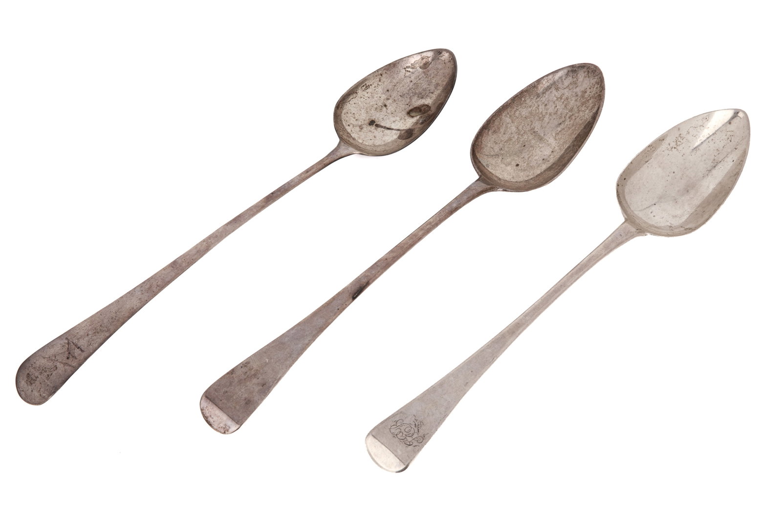 THREE GEORGIAN SILVER STUFFING SPOONS, 289g: English Georgian hallmarks, two with engraved terminals. Weight 289 grams Length of longest spoon 12.2in (31cm)