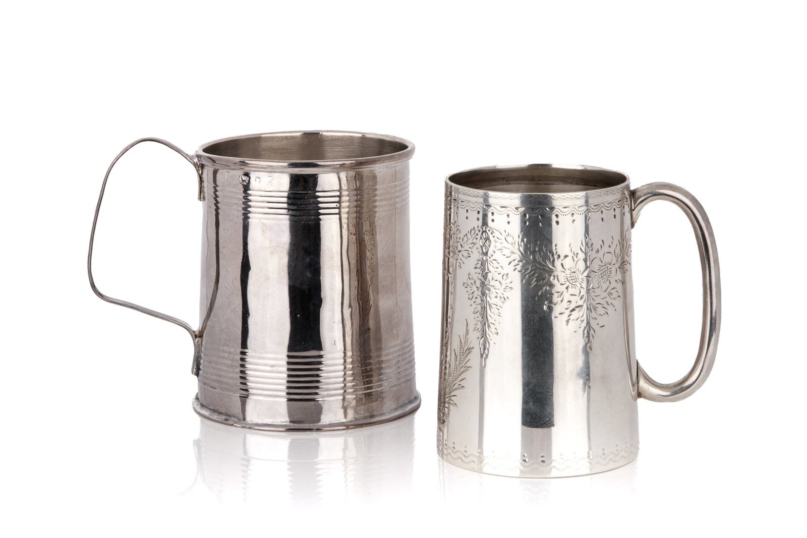 TWO ENGLISH SILVER MUGS, 197g: One with reeded banded details hallmarked for Thomas & Daniel Leader, Sheffield, 1798; the other featuring engraved floral and foliage decoration hallmarked Victorian, Mappin & Webb, Sheffield, 1885.