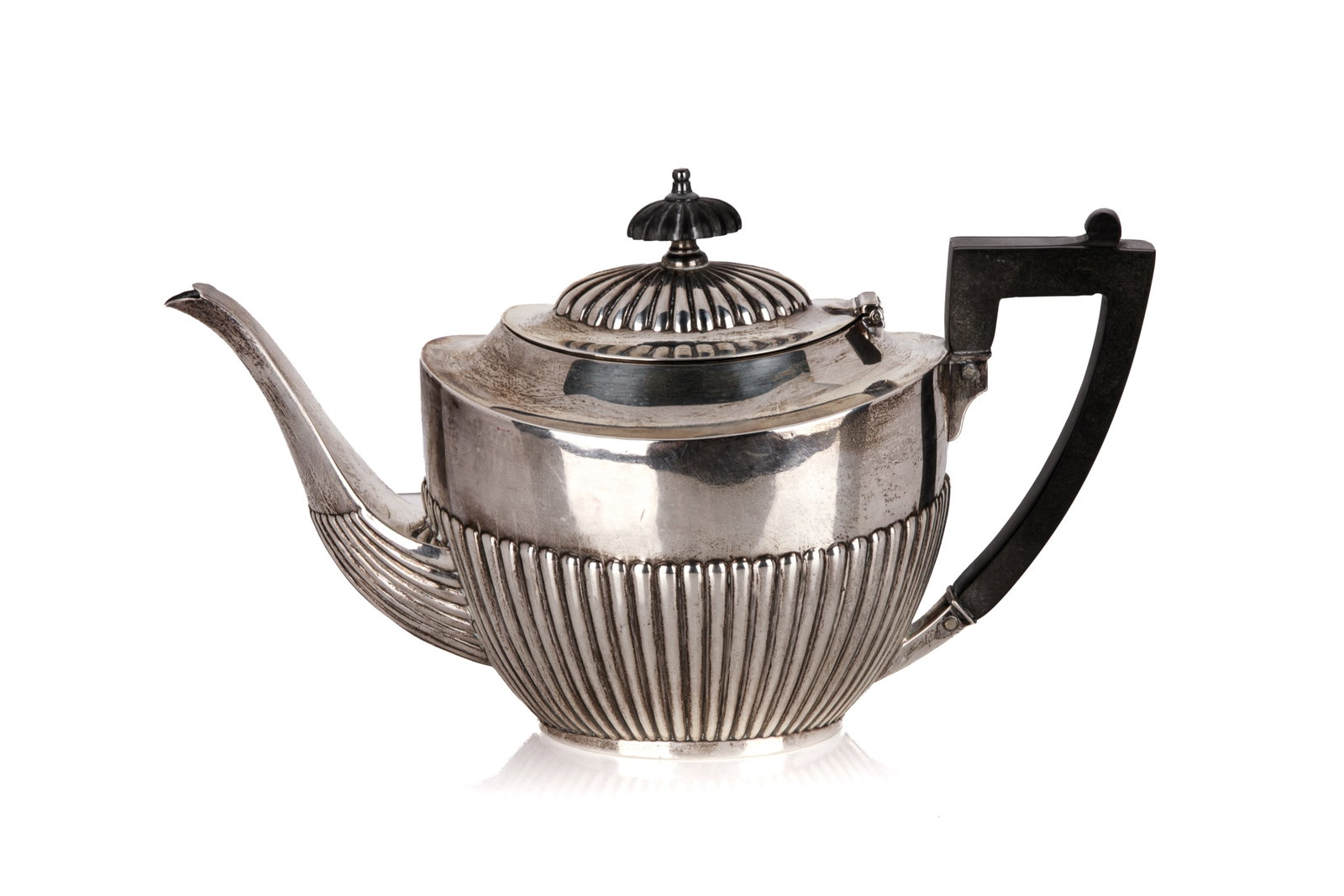 BIRKS SILVER REEDED TEAPOT, 451g: 1 oval reeded form silver teapot with a wooden handle and finial. Stamped "BIRKS STERLING RYRIE" to the base. Overall weight 451grams L. 10 1/2in (26.7cm)