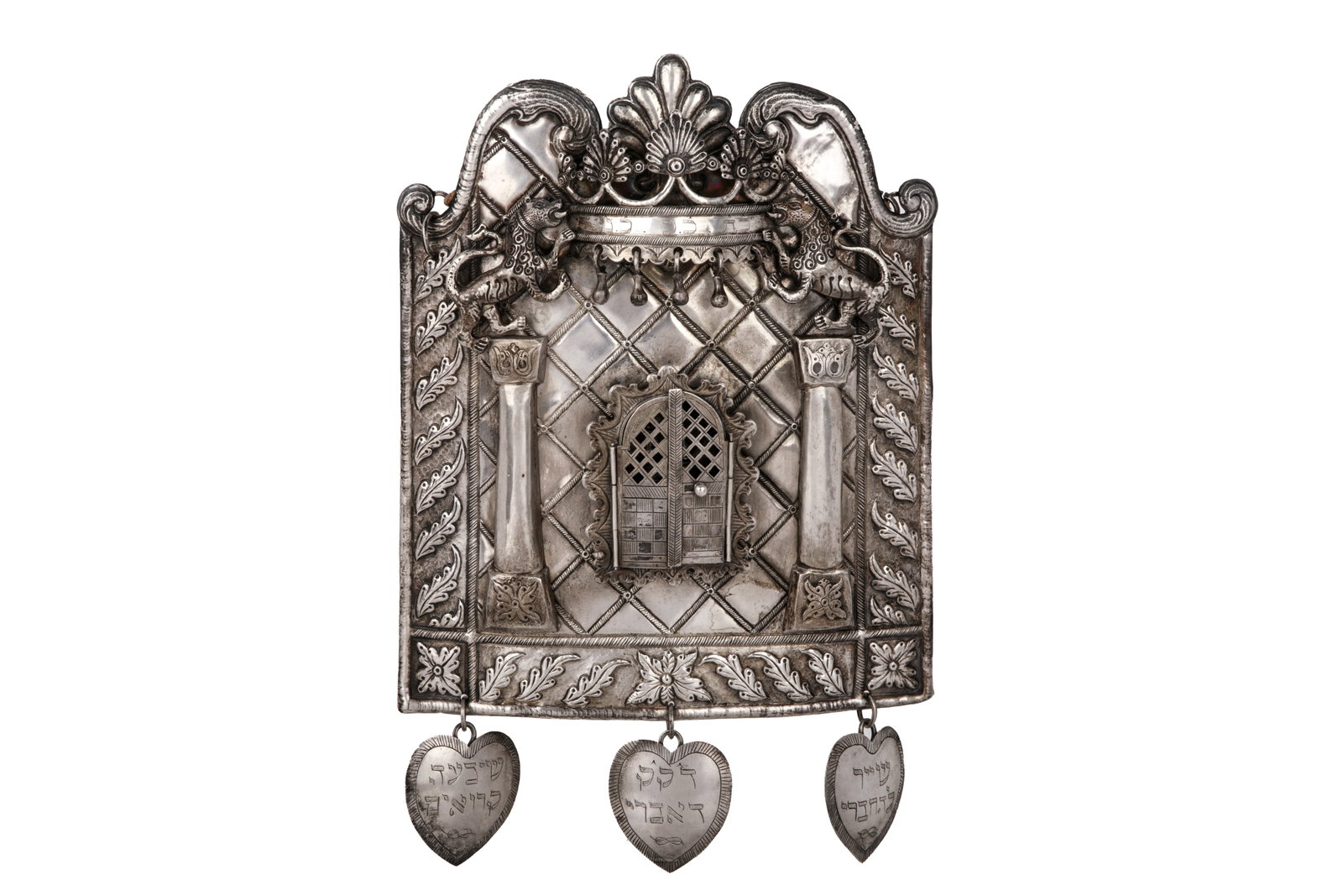 ANTIQUE SILVER TORAH BREASTPLATE TAS, 591g: Sheild with central arc flanked by columns, crown top, heart shaped drops with Hebrew text, Probably German, 18th / 19th C. Unmarked.H 9 1/2in (24cm) x L 7 3/4in (20cm) 591g