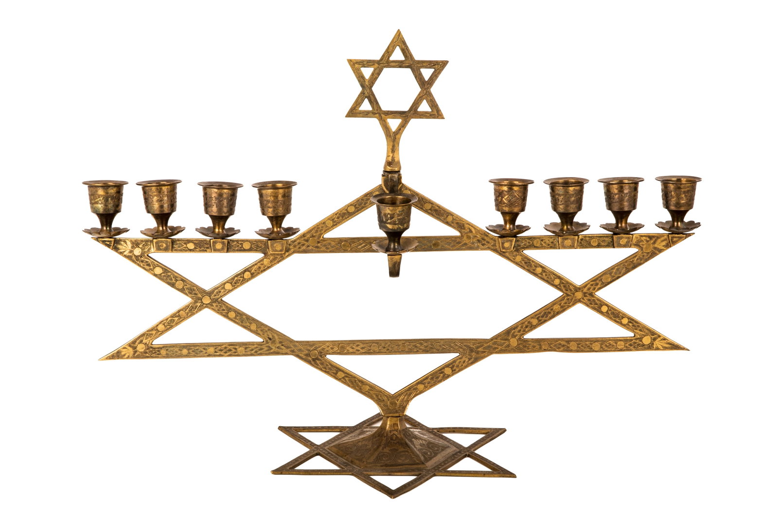 ANTIQUE INDIAN BRASS HANUKKAH MENORAH: Brass hand engraved designed with three stacked Stars of David, Indian 1920s. Lable from exhibition JMP 52. H 36.5cm (14 1/2in)