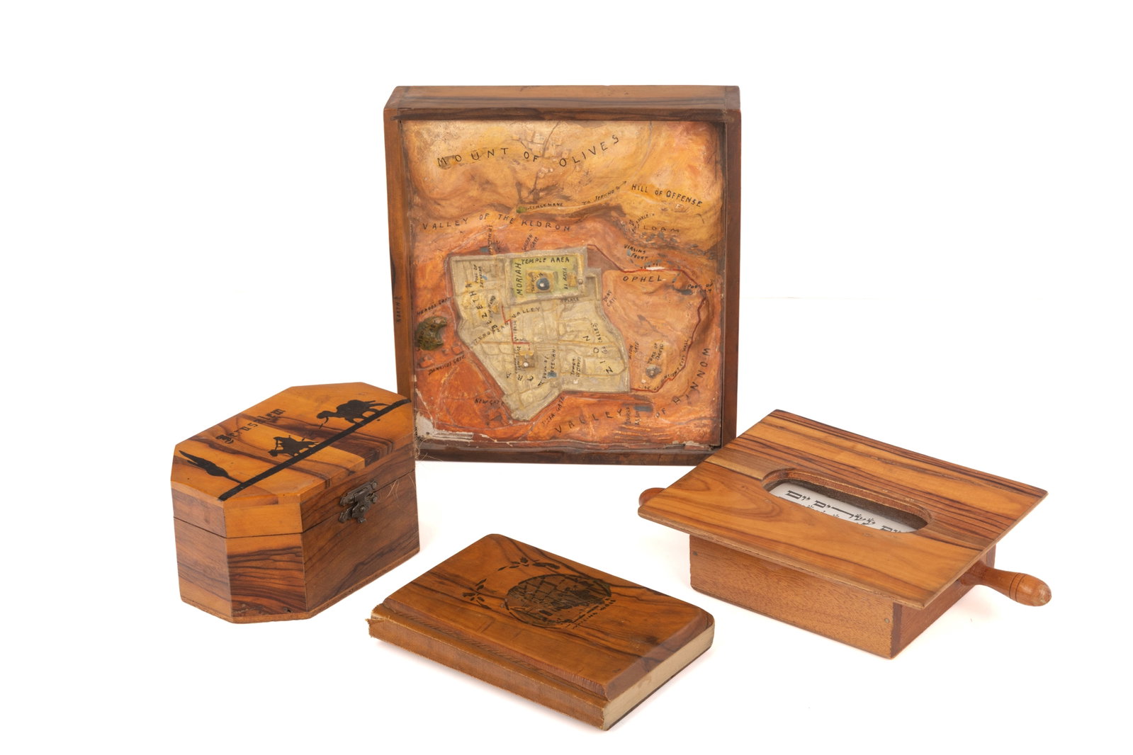 GROUP OF JERUSALEM OLIVEWOOD SOUVENIERS: An Etrog box, Readings from the Holy Scripture book with wood cover, Book of Esther scroll and raised three dimensional map of jerusalem with olivewood frame.W of map 17cm (6 7/8in)
