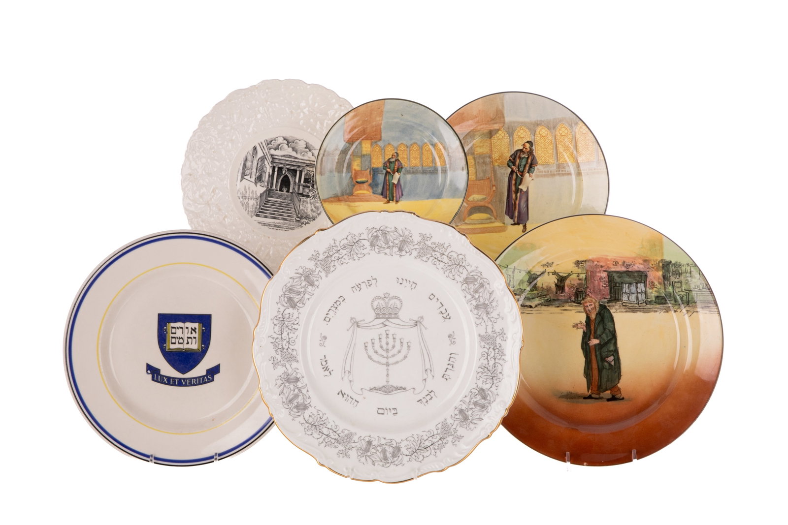 SIX ANTIQUE JEWISH CONTENT POTTERY PLATES: Three Royal Doulton Series plates Shylock, Fagin from Dickens, Coalport Passover, Yale University plate with Coat of Arms and Royal Cauldon The Synagogue.Dia of largest Doulton25.5cm (10 1/8in)