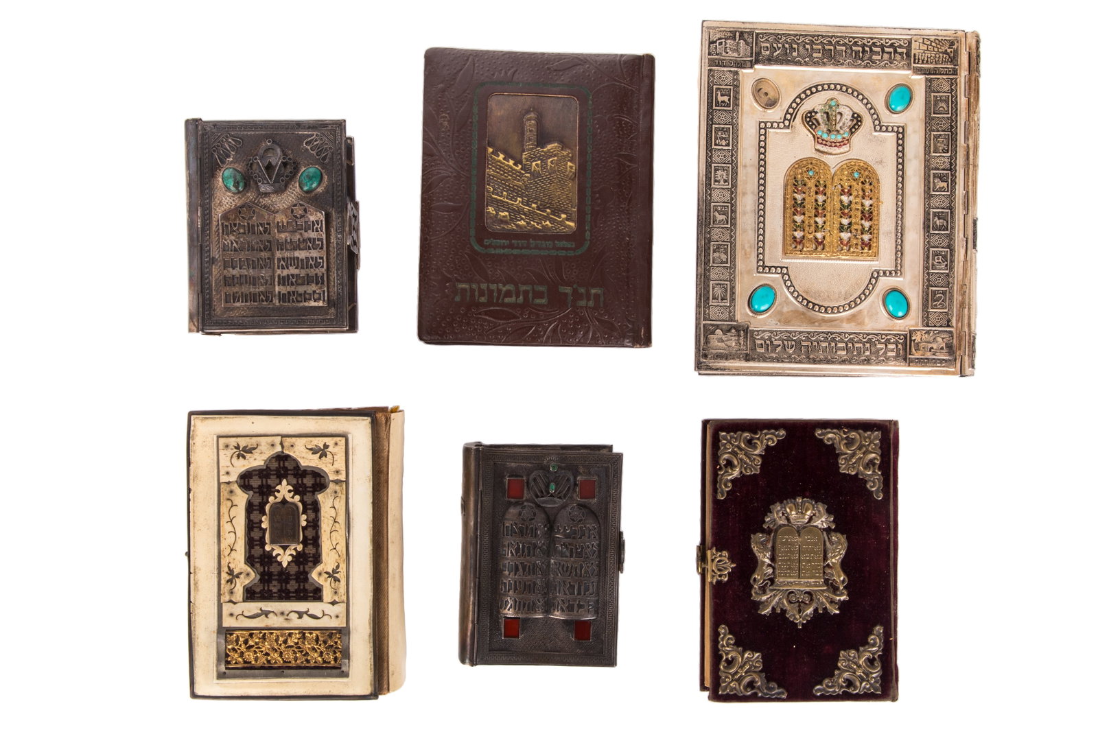 SIX ANTIQUE DECORATED JEWISH PRAYER BOOKS: Two with sterling silver and gemstone covers, a silverplated cover, leather and bone binding, all early to mid 20th C. H 8 3/4in (22.5cm) x L 7 1/4in (18.5cm)
