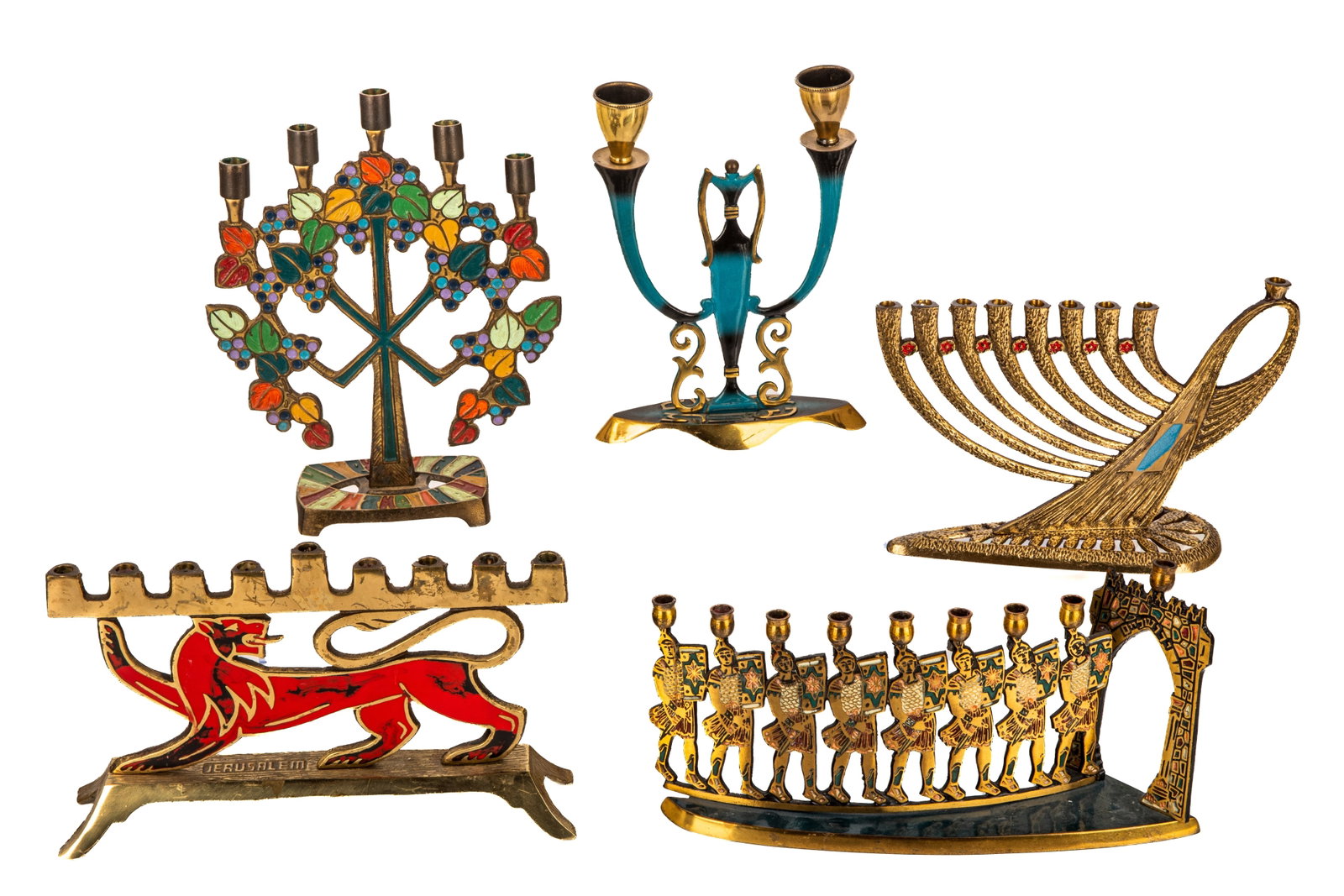 FIVE VINTAGE BRASS HANUKKA MENORAHS: With mixed coloured decoration and designs. H of terra sancta guild 23.5cm (9 1/4in)