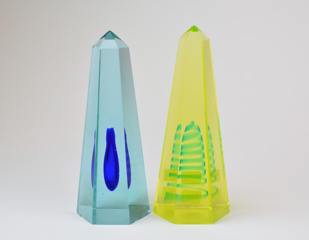 Two Coloured Glass Obelisks: In Vaseline and blue with coloured interiors.