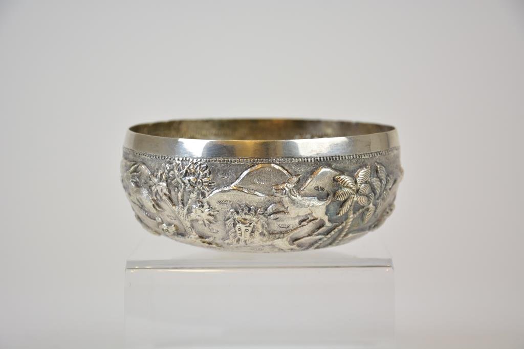 Cutch Colonial Indian Silver Bowl: Embossed with fighting exotic animals, Indian maker's mark to base. 125 g. Dia 11.1 cm. (4 3/8 in.)