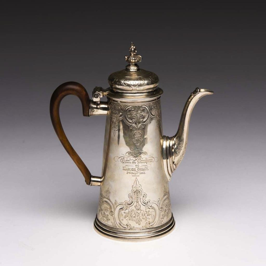 GEORGE II ENGLISH SILVER COFFEE POT: Lighthouse form with original bright cut engraving, London, 1730, Charles Perier. 890 gr. H 25 cm (9 7/8 in.) Inscribed: Presented by the Earl of Durham To Marion Grant, 2nd Sept. 1862.