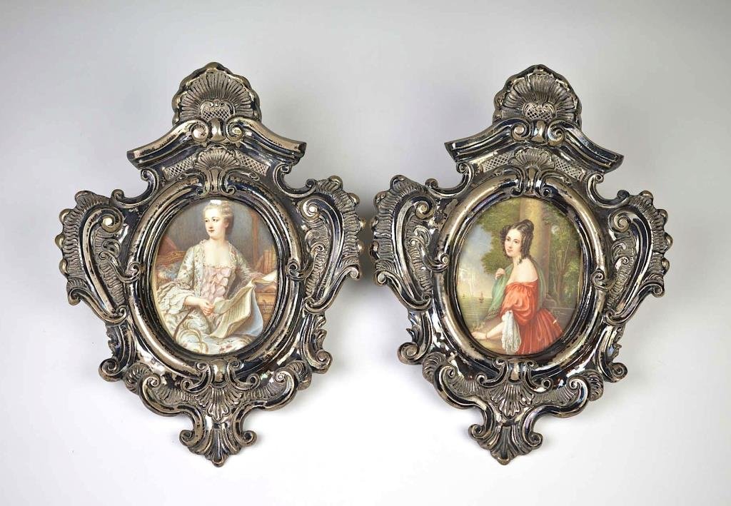 TWO CONTINENTAL SILVER PLATED FRAMES: Baroque oval design with spurious marks, each set with a hand painted portrait miniature, signed Latour and R. Rossi. H 32.5 cm (12 1/2 in.)