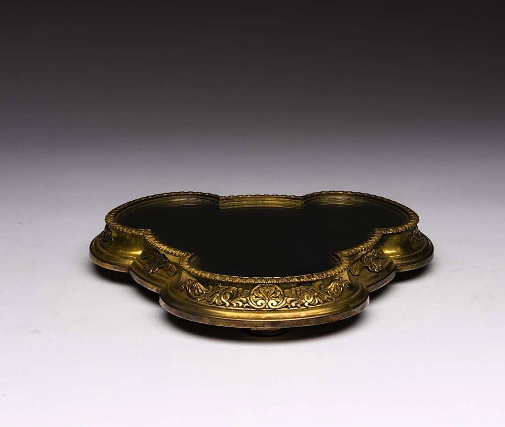 ELKINGTON SILVER PLATED TREFOIL PLATEAU: Gilt body with acanthus trim raised on tripod feet with wood base, 1877. L 34.3 cm (13 1/2 in.)