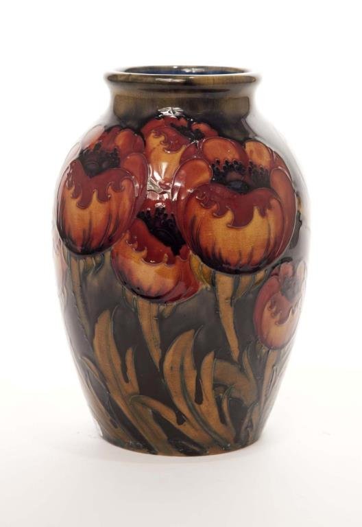 MOORCROFT POPPY PATTERN POTTERY VASE: Light flambe, signed William Moorcroft, circa 1920. H 24 cm (9 1/2 in.)
