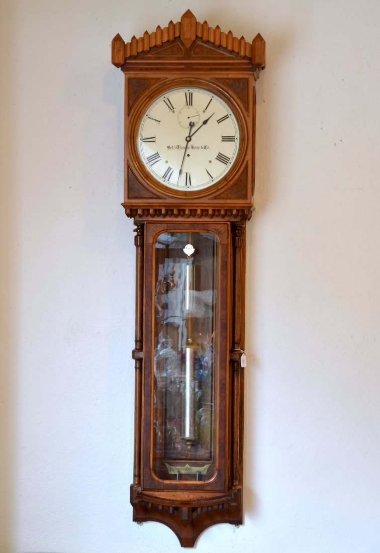 RARE SETH THOMAS NO. 12 REGULATOR CLOCK: Richly grained walnut wood case with glazed front and sides. Silvered dial with makers mark, circa 1880. H 72 in. The movement appears to be all original as does the case. The dial is in excellent con