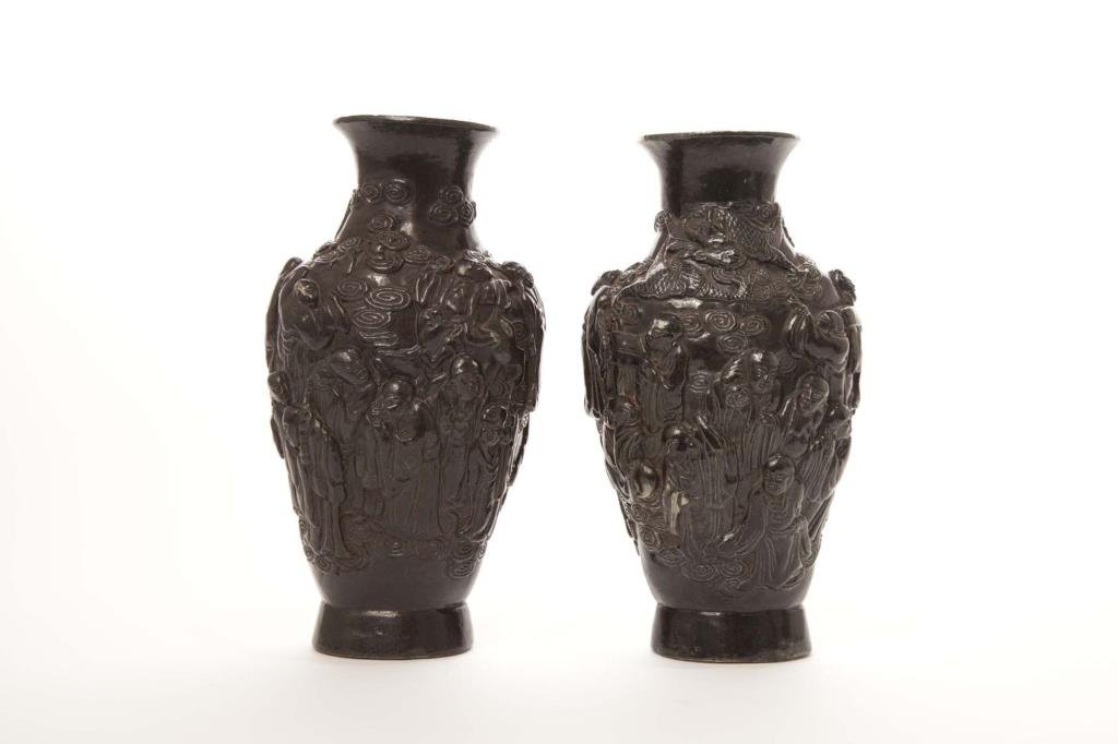 PAIR OF CHINESE QIANLONG FAUX BRONZE LUOHAN VASES: Molded porcelain black glaze body with eighteen Luohans and a dragon,six-character Qianlong mark to base, mark and period. H. 22cm (8 3/4 in.)